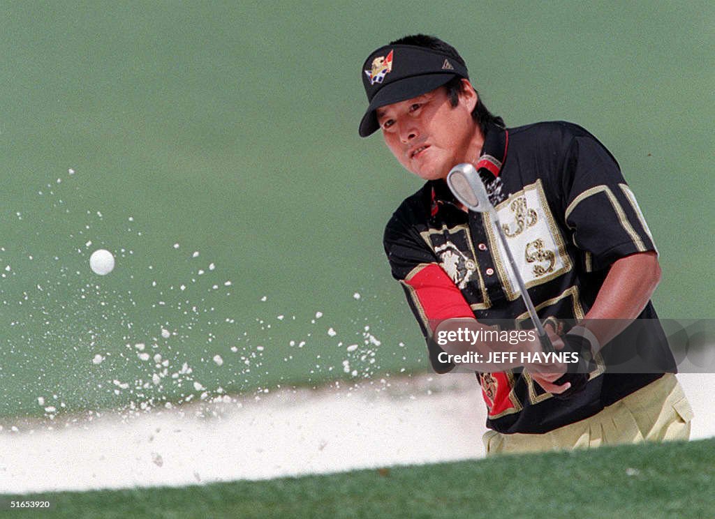 Jumbo Ozaki of Japan chips onto the second green 1