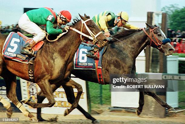 Jockey Gary Stevens aboard Silver Charm beats Captain Bodgit with Alex Solis aboard in a photo finish in the 123rd running of the Kentucky Derby 03...
