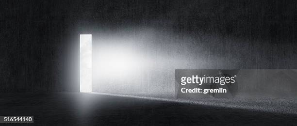mysterious door with glowing light - light at the end of the tunnel stock pictures, royalty-free photos & images
