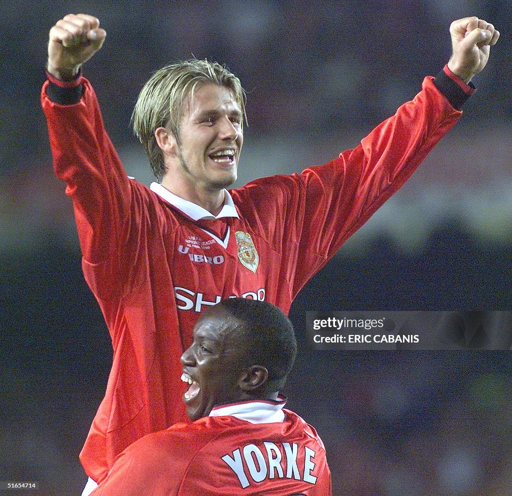Forward Dwight Yorke and midfielder David Beckham