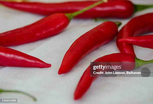 Finger Chilli Finger Hot Peppers On White Photos and Premium High Res Pictures ...