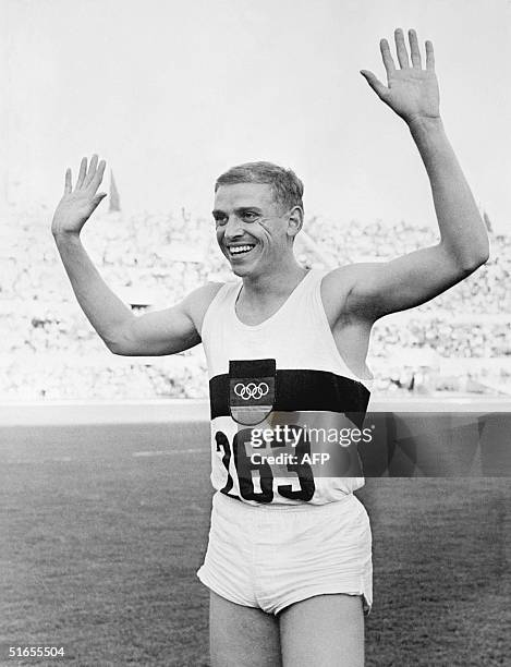 German Armin Hary waves to the public as he just crossed the finish line at the 100m during the Olympic Games in Rome, 01 September 1960. Armin Hary...