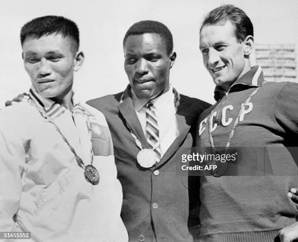 Olympics Decathlon medalists stand on the podium, Rome 08 September 1960. US Rafer Johnson won gold, Taiwan Yang Chuan-Kwang took silver and USSR...