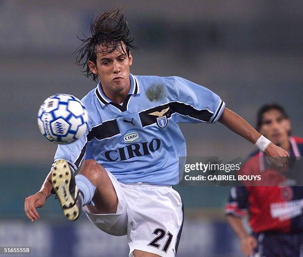 Lazio Roma's striker Simone Inzaghi controls the ball ahead of Cagliari's defender Fabio Macellari during their Italian Serie A game 30 August 1999...