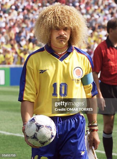 Colombian midfielder Carlos Valderrama walks off the field at the end of the World Cup second first-round Group G match between Colombia and Tunisia,...