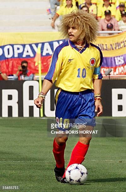 Colombian midfielder Carlos Valderrama looks to his right as he dribbles the ball, 22 June at the Stade de la Mosson in Montpellier, during the World...