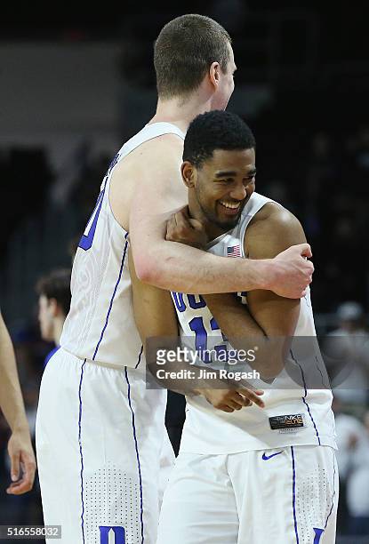 Marshall Plumlee of the Duke Blue Devils and Matt Jones celebrate defeating the Yale Bulldogs 71-64 during the second round of the 2016 NCAA Men's...