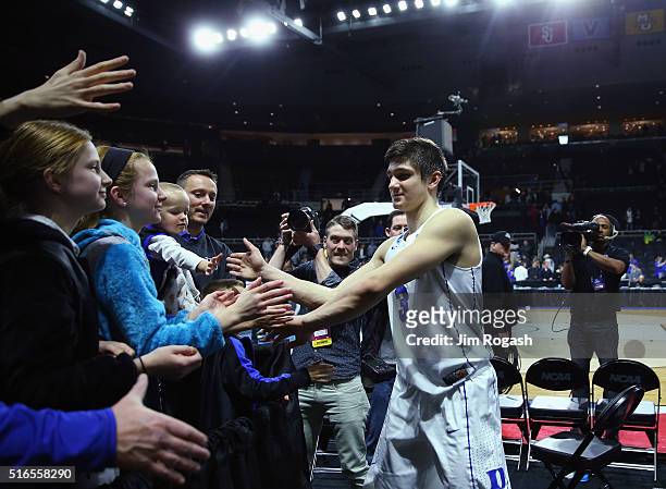 Grayson Allen of the Duke Blue Devils high fives fans after defeating the Yale Bulldogs 71-64 during the second round of the 2016 NCAA Men's...