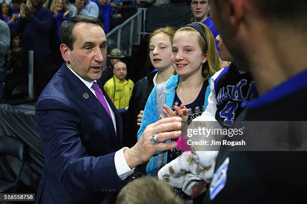 Head coach Mike Krzyzewski of the Duke Blue Devils greets fans after defeating the Yale Bulldogs 71-64 during the second round of the 2016 NCAA Men's...