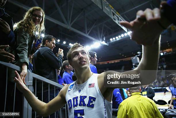 Luke Kennard of the Duke Blue Devils greets fans after defeating the Yale Bulldogs 71-64 during the second round of the 2016 NCAA Men's Basketball...