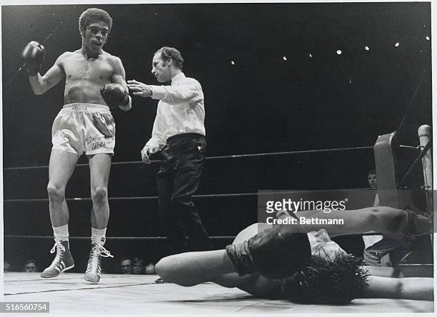 London: Vernon Sollas of Edinburgh being waved back by referee after knocking out Martin Galleozzie of Merthyr in the seventh round of their 8 round...