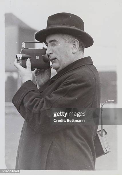 When Mr. R.G. Menzies, Premier of Australia, now in England recently toured the North Country, he took his cine-camera with him. And he is seen here...