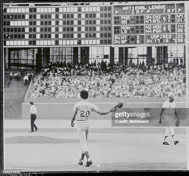 Cesar Geronimo throws down his batting helmet after becoming the 3,000th strikeout vistim of St. Louis Cardina;s' pitching ace Bob Gibson in the...