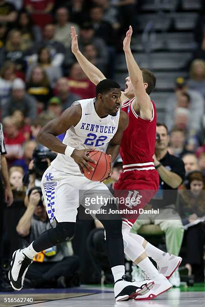 Alex Poythress of the Kentucky Wildcats fouls Max Bielfeldt of the Indiana Hoosiers in the first half during the second round of the 2016 NCAA Men's...