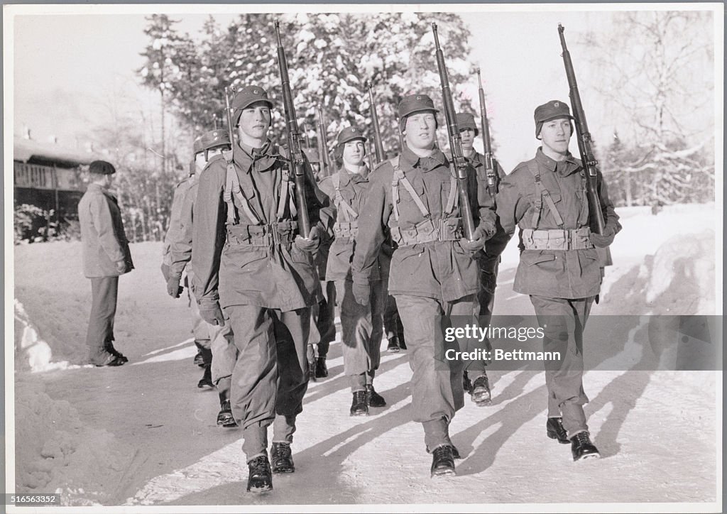 Young Soldiers Marching in Snow
