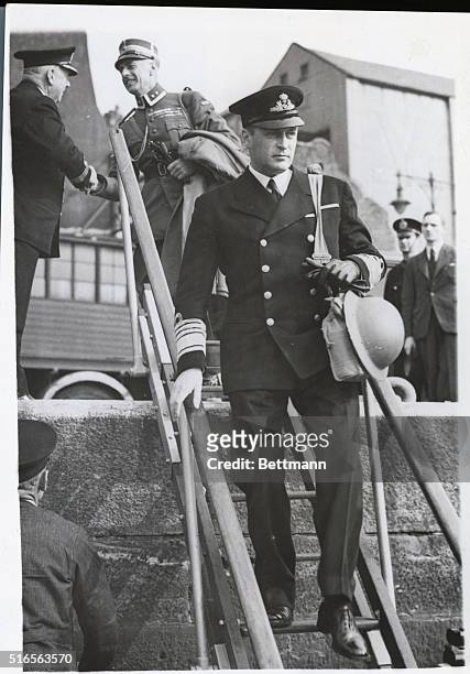 Prince Olaf Inspects Norwegian Shipping Here. Keystone Photo shows: Crown Prince Olaf of Norway pictured stepping down a gangway onto a launch,...