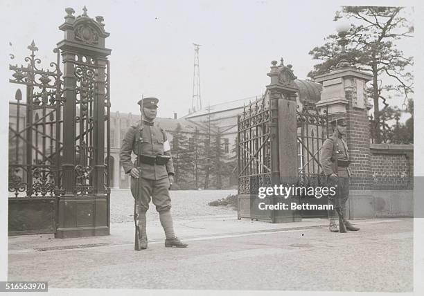 Undated photo of military guards holding bayonets at the entrance of the House of Representatives, a reminder that Tokyo is still under martial law.