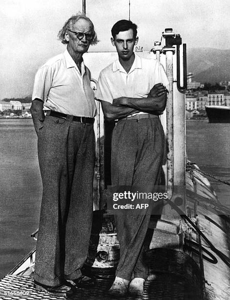 Swiss born physicist, Auguste Piccard , poses with his son Jacques Piccard on the deck of the Trieste bathyscaphe in the sixties. Jacques Piccard was...