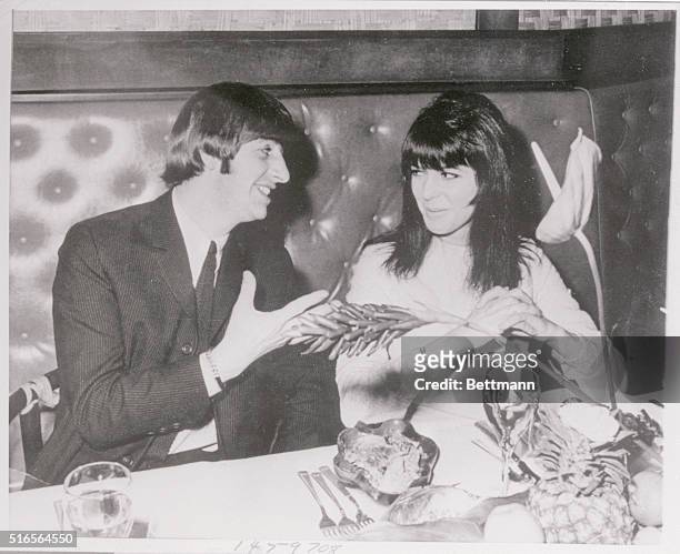 Beatle drummer Ringo Starr chats animately with his new bride, the former Maureen Cox, in photo taken last week in London at a luncheon honoring J....