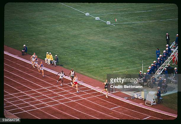 Peter Snell of New Zealand winning the 800 meter. View as he breaks the tape.