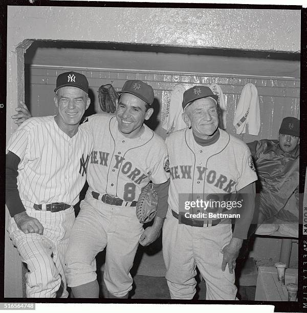 Yankees manager Johnny Keane enjoys a laugh with Mets coach Yogi Berra and manager Casey Stengel before the start of their annual Mayor's Trophy...