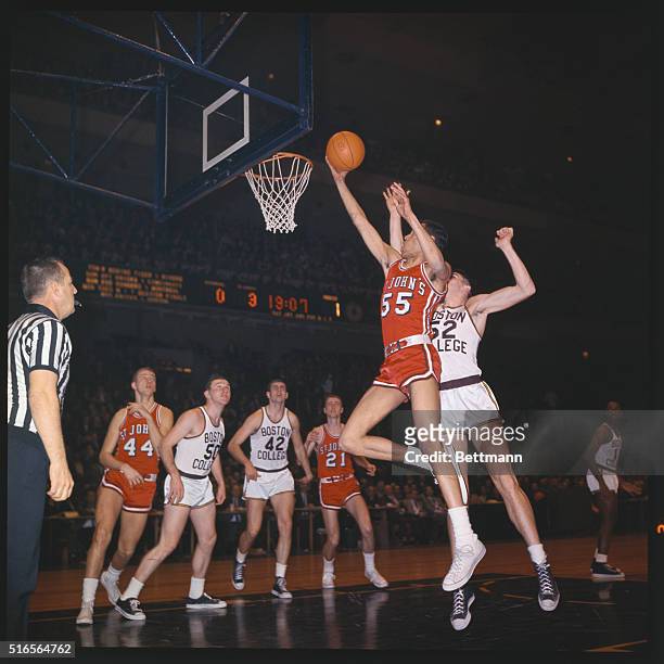 National Invitation Tournmament-Madison Square Garden came between Boston College and St. Johns. No. 52 Willie Wolsters, prevents score by no. 55,...