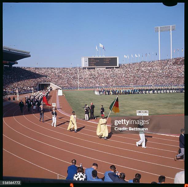 Japan, Tokyo: Canadian Team entered National stadium during opening ceremonies for the XVIII Olympiad.