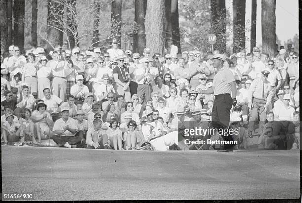 Augusta, Ga.: Jack Nicklaus' caddie is bowled over by his emotions as Jack sinks a birdie putt on the 16th hole during second round Masters...