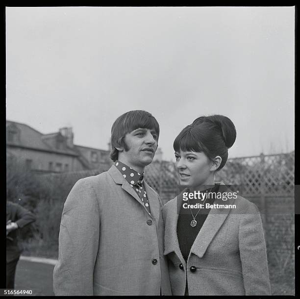 Hove, Sussex, England: Put Their Heads Together. Beatle drummer Ringo Starr and his bride, the former Maureen Cox, put their heads together outside...