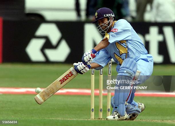 Indian opening batsman Sachin Tendulkar hits a shot off the bowling of South Africa's Jacques Kallis in the Cricket World Cup at Hove 15 May 99. The...