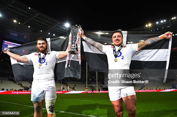 Luke Cowan-Dickie and Jack Nowell of England celebrate with the trophy following their team's 31-21 victory during the RBS Six Nations match between...