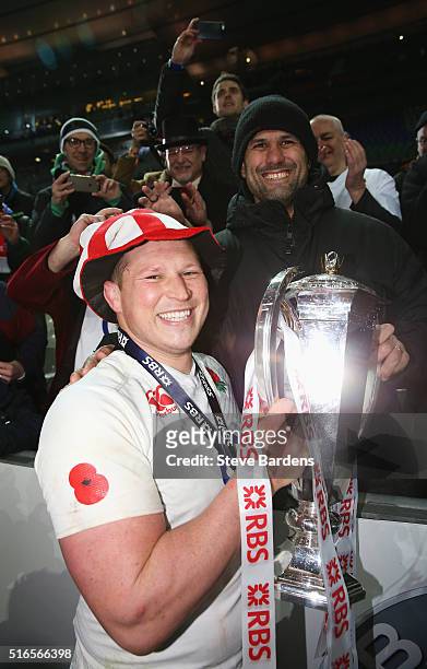 Dylan Hartley of England celebrates with the RBS Six Nations trophy after England won the Grand Slam during the RBS Six Nations match between France...