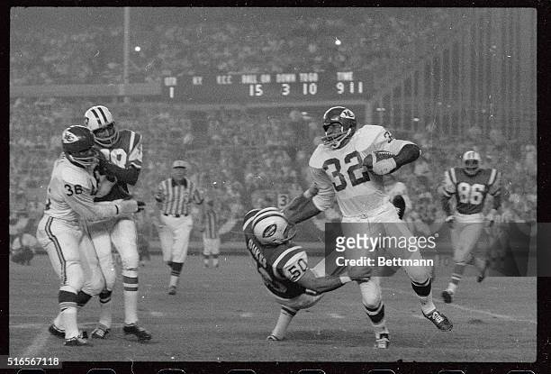 Kansas City Chiefs' halfback Curtis McClinton shakes off New York Jets Mike Dukes for eight yards in the game at Shea Stadium.
