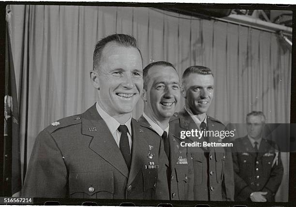 Space twins Edward H. White and James McDivitt , and Capt. Joe H. Engle, x-15 pilot , are shown at the pentagon today after receiving their astronaut...