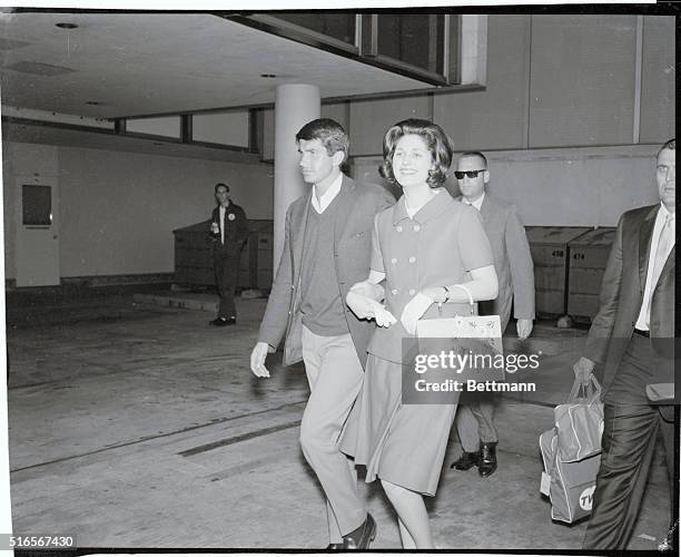 Los Angeles, California: Actor George Hamilton and Lynda Bird Johnson leave International Airport, March 17, after the actor met Miss Johnson's...