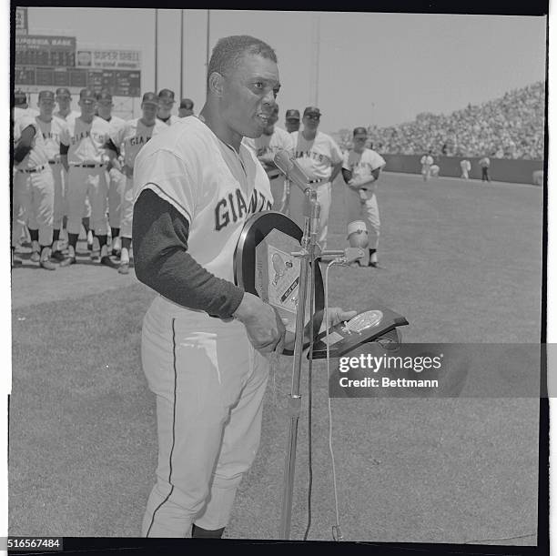 Willie Mays expresses his appreciation here, after receiving two coveted awards from the National League President Warren Giles between games of a...