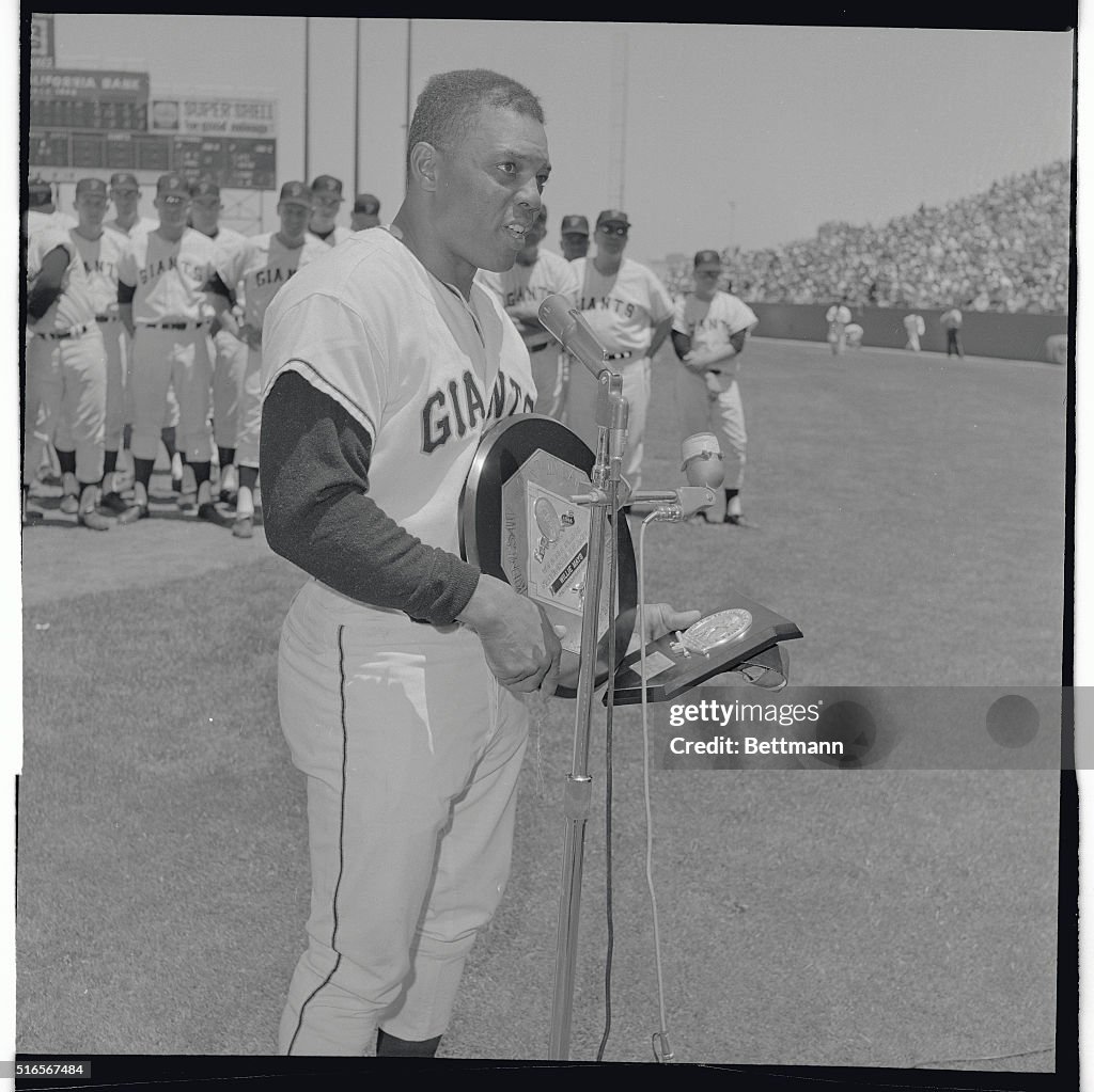 Willie Mays Standing at Microphone with Award