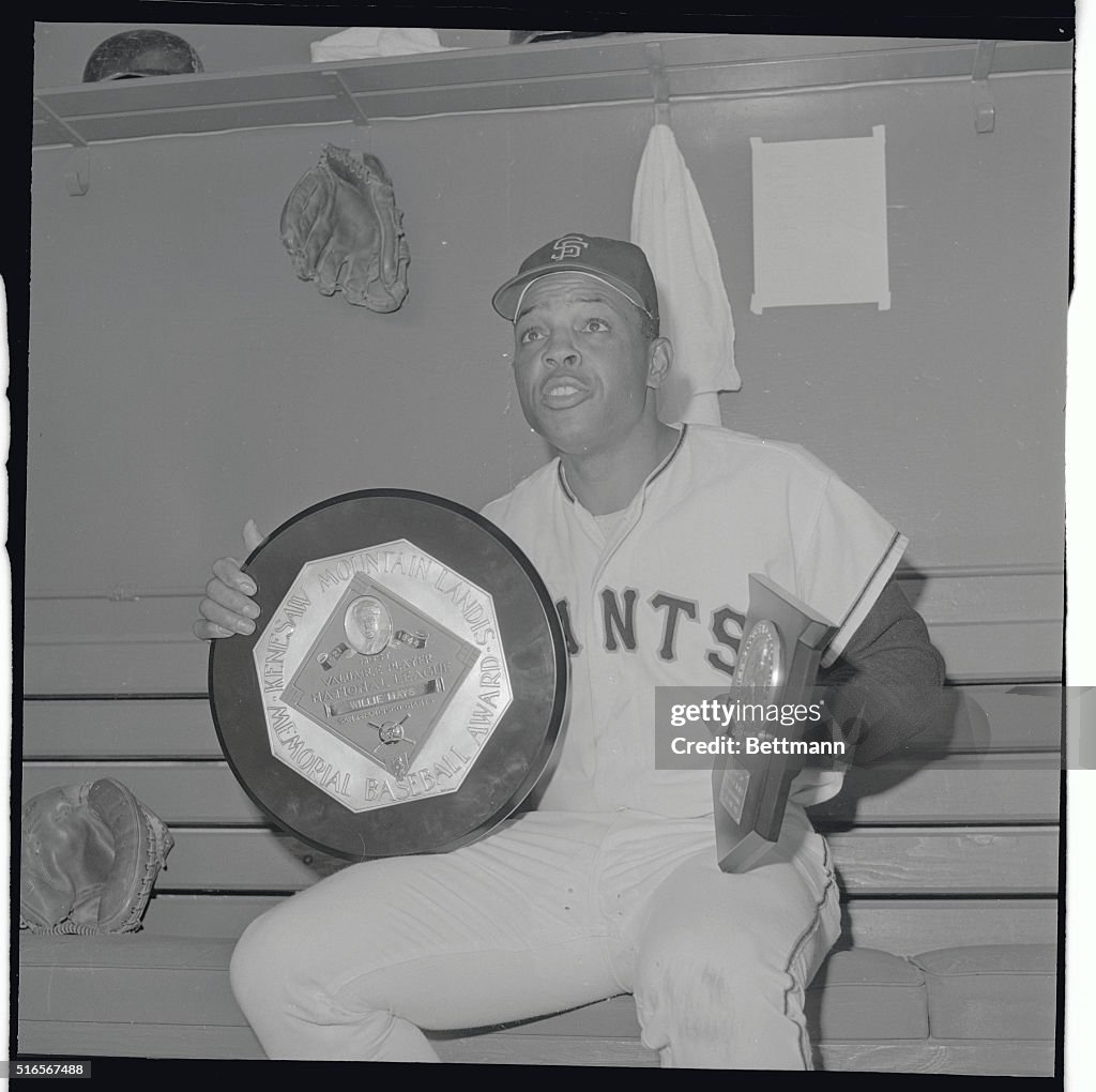 Willie Mays Sitting and Holding His Award