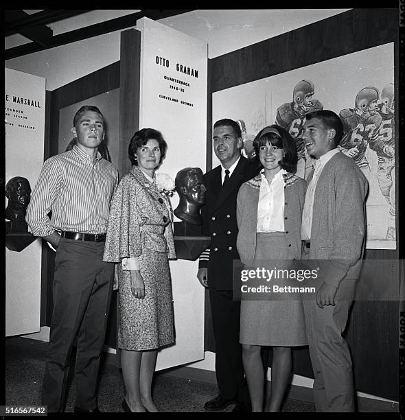 Otto Graham, Cleveland Browns famed quarterback, was honored at the Professional Football Hall of Fame at Canton, Ohio. Here, he poses with members...
