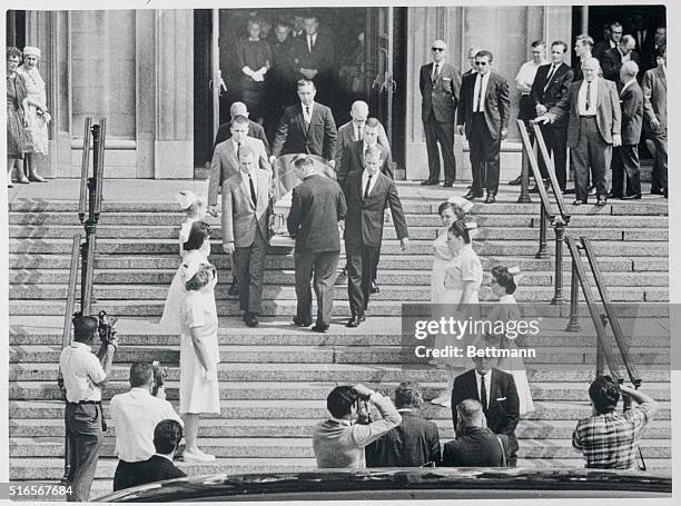 Six of Gloria Jean Davy's fellow student nurses stand as honorary pall bearers, as her body is carried from St. Joseph's Church July 16th. Gloria...