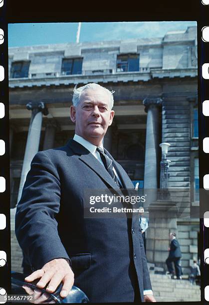 New Zealand Prime Minister Keith J. Holyoake outside the parliament building.