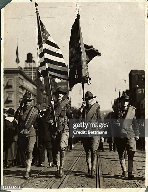 Picture shows a World War I parade of color bearers of the 7th Regiment.