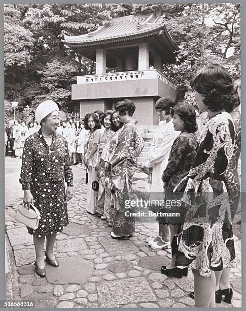 Tokyo: Empress Nagako of Japan exchanges greetings with Gakushuin school girls as she attends annual Alumni Association at Chinzanso Banqueting Hall...