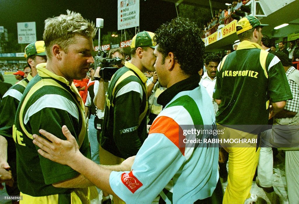 Indian cricketer Sachin Tendulkar (C) shakes hands