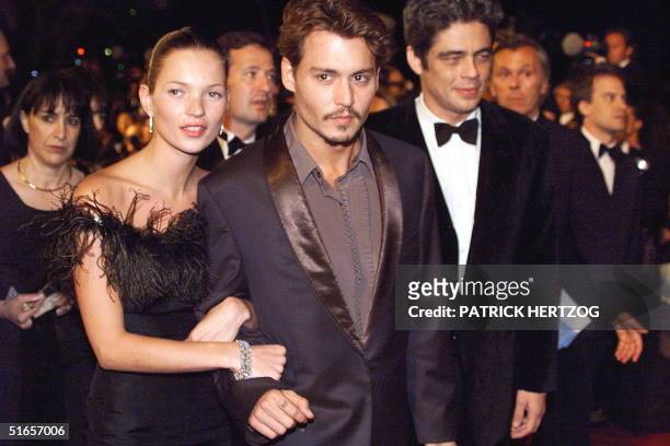 Actors Johnny Depp and Benicio Del Toro accompanied by model Kate Moss arrive, 15 May at the Palais des festivals for the screening of the film "...