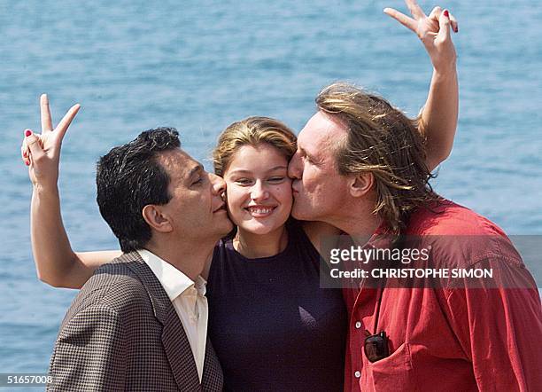 French actors Christian Clavier , Gerard Depardieu and model Laeticia Casta, pose for photographers for the promotion of their film "Asterix and...