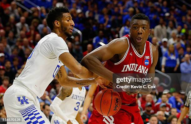 Marcus Lee of the Kentucky Wildcats fouls Thomas Bryant of the Indiana Hoosiers in the second half during the second round of the 2016 NCAA Men's...