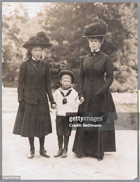 Queen Mary , the queen-consort of England, and wife of George V, with her children, Prince John and Princess Mary.