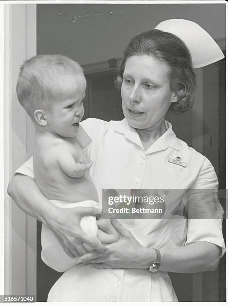DAVID, AGE 4, BORN WITH FLIPPER ARMS AND LEGS, HELD BY NURSE RUBY TATE AT THE CHILDHOOD REHABILITATION CENTER OF THE UNIVERSITY OF VIRGINIA,...
