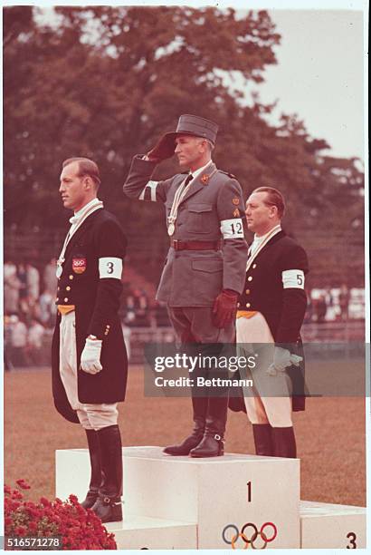 Olympics-1964. Japan, Tokyo: Winners of the Equestrian Grand Prix De Dressage event on the victory stand, first place Henry Chammartin of...